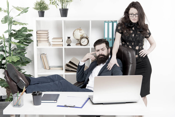 Business people and office staff. Sexy secretary personal assistant. Typical office life. Man bearded hipster boss sit in leather armchair office interior. Boss and secretary girl at workplace - Zdjęcie, obraz