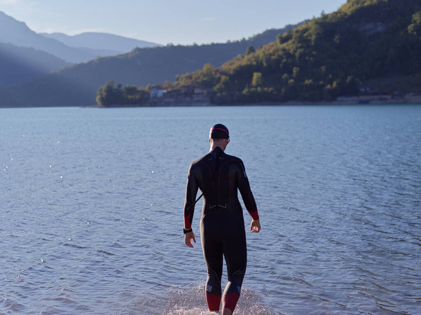 triathlete swimmer portrait wearing wetsuit on training - Φωτογραφία, εικόνα