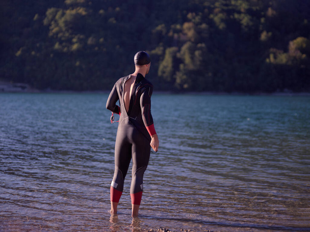 triathlete swimmer portrait wearing wetsuit on training - Foto, immagini