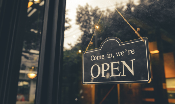 COME IN, WE ARE OPEN - Open sign broad hang on entrance door with copy space at coffee shop or restaurant - Fotó, kép