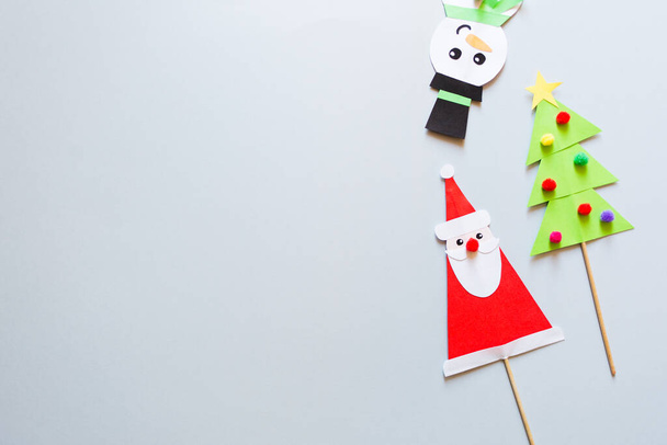 paper craft for kids. snowman, Santa Claus and christmas tree on blue background. create art for children. new year concept - Φωτογραφία, εικόνα