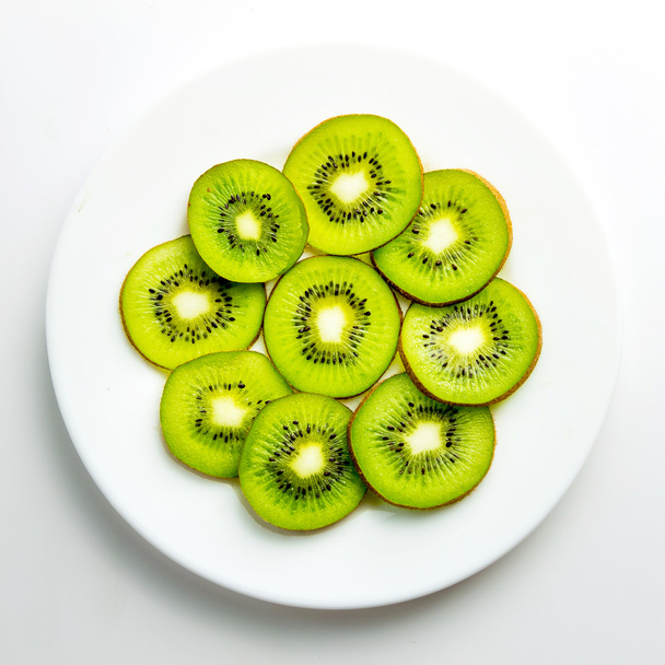 Kiwi on a plate - Фото, изображение