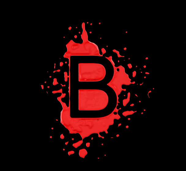 Red blot B letter over black background - Фото, зображення