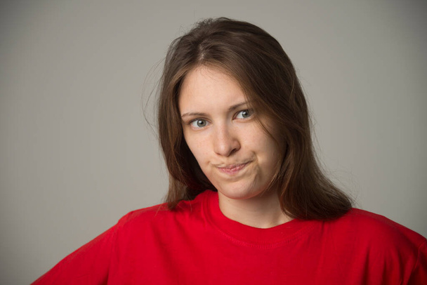 angry girl in a red tank top - Fotó, kép