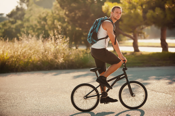 Young man sitting on sport bike - 写真・画像