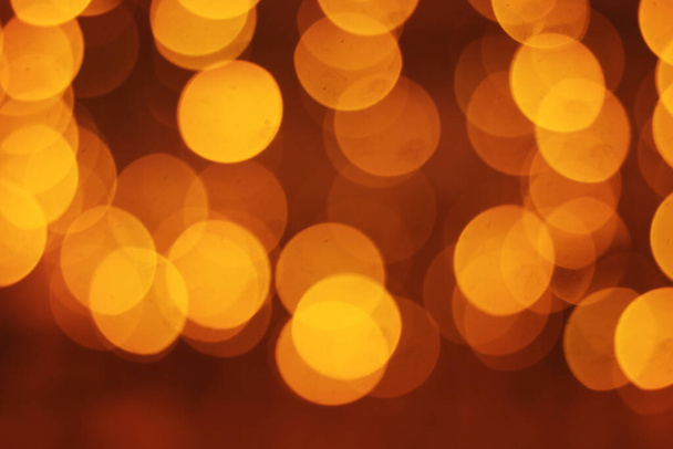 A beautiful blurry golden circle lights for a Christmas background - Photo, Image