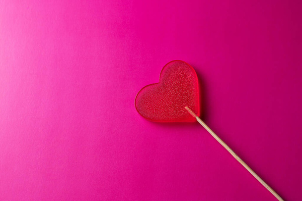 pink lollipop heart on pink background - Foto, imagen