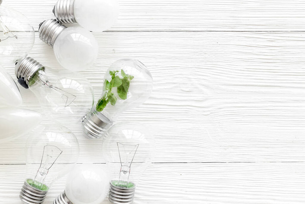 Light bulb with green grass - renewable energy eco concept - Foto, Bild