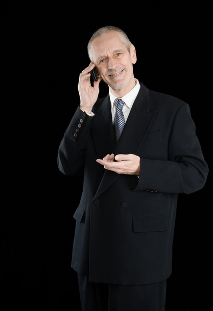 Достойный и улыбчивый бизнесмен по телефону
 - Фото, изображение