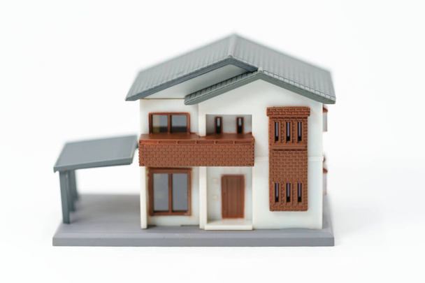 Un modelo de casa modelo se coloca en el papel .as de fondo de los espacios de copia de concepto de bienes raíces para su texto o diseño. - Foto, Imagen