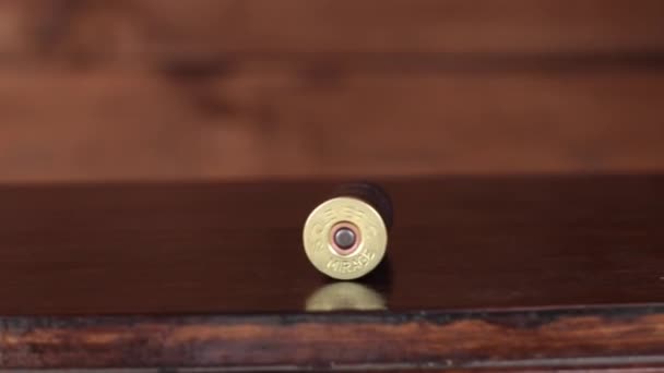 Bullet casings collecting in wodden bowl 4K UHD - Footage, Video
