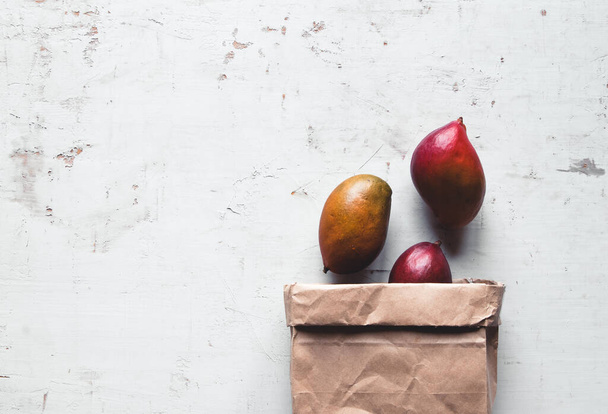 Mango in a Brown Paper Bag. Healthy food, healthy lifestyle. - Фото, зображення