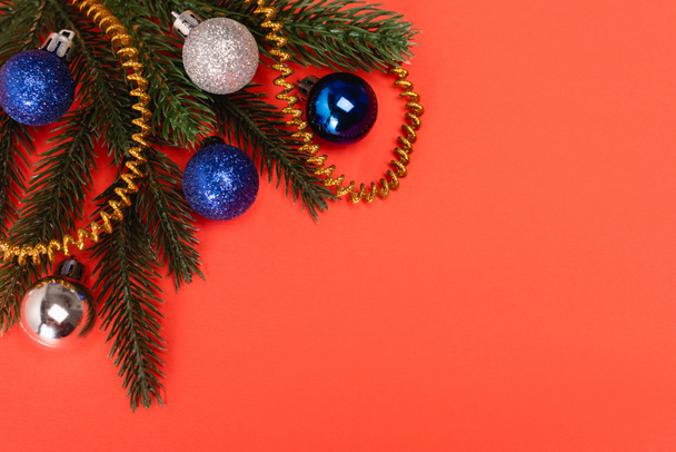 top view of decorated Christmas tree on red background - Фото, изображение