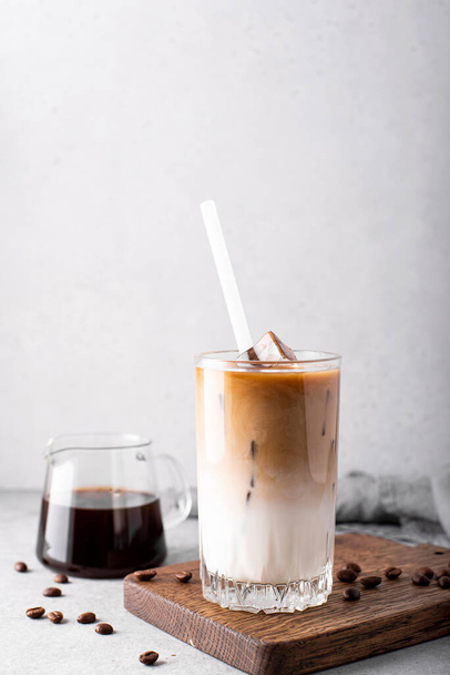iced milk coffee with ice cubes in tall glasses, close up - Valokuva, kuva