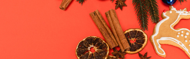 top view of Christmas tree, spices and gingerbread cookie on red background, banner - Φωτογραφία, εικόνα