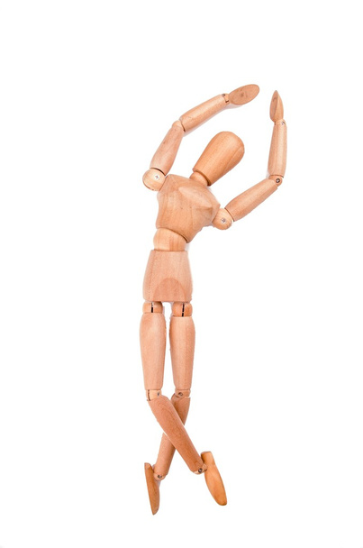 Dancing wood model figure on a white background - Foto, afbeelding