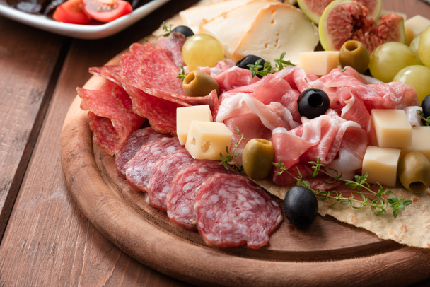 Platter of delicious italian antipasti  - Фото, зображення