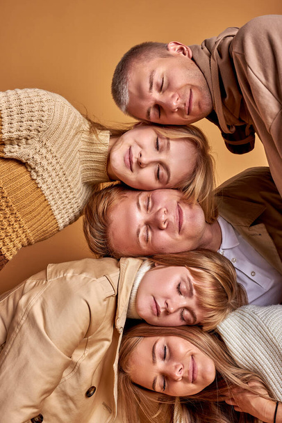 group of sleepy young people on each other - Фото, изображение