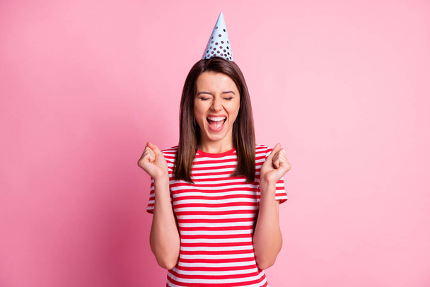 Photo portrait of cheerful happy girl smiling shouting screaming surprised with closed eyes isolated on pastel pink color background - Φωτογραφία, εικόνα