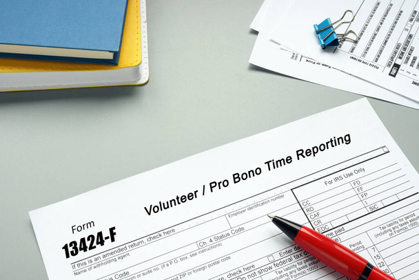 Form 13424-F Volunteer / Pro Bono Time Reporting inscription on the page - Photo, Image