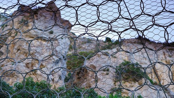 robust rockfall barrier along the panoramic road of buggerru, south sardinia - Photo, Image