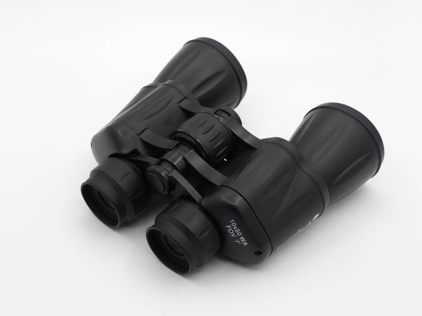 Black travel binoculars on a light background - Fotografie, Obrázek