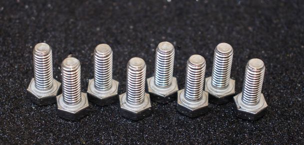 stainless bolts on black background - Photo, Image
