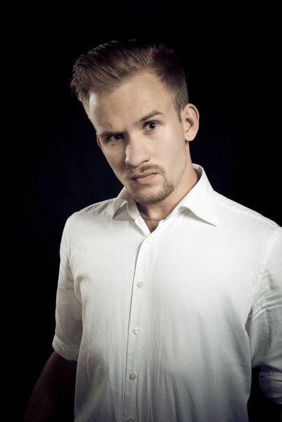 Young man dressed in white shirt studio portrait - Foto, immagini