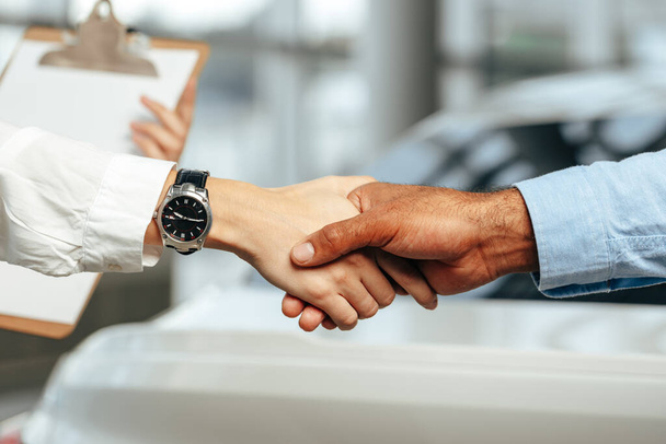 Female and male businesspeople handshake close up - Fotó, kép