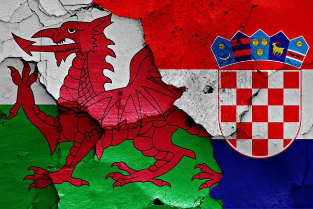 flags of Wales and Croatia painted on cracked wall - Photo, Image