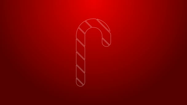 Zielona linia Christmas Candy trzciny z ikoną paski izolowane na czerwonym tle. Wesołych Świąt i szczęśliwego Nowego Roku. 4K Animacja graficzna ruchu wideo - Materiał filmowy, wideo