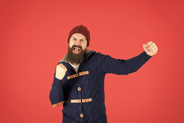 Happiness. Man bearded hipster stylish fashionable jumper and hat. Emotional expression. Casual clothes for winter season. Hipster with long beard. Hipster lifestyle. Stylish outfit hat accessory - Photo, Image