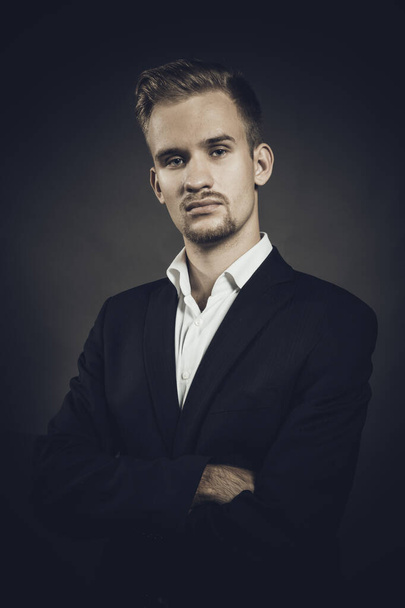 Young man dressed in suit studio portrait - Фото, зображення