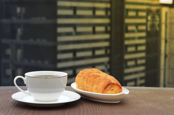Coffee cup and breakfast cake with luxury hotel background - Photo, Image