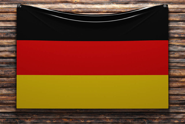 3D illustration of the national   fabric flag of Germany nailed on a wooden wall .Country symbol. - Photo, Image