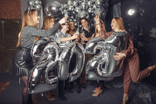 People celebrating a new year with a big ballons - Foto, Imagen