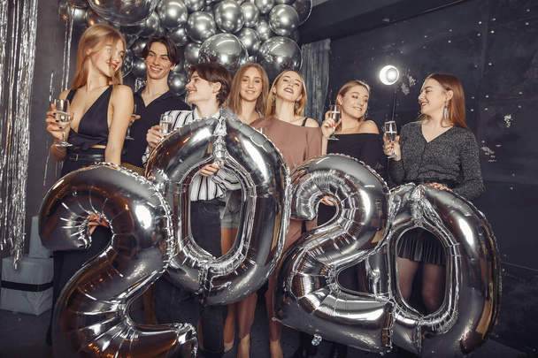 People celebrating a new year with a big ballons - Valokuva, kuva