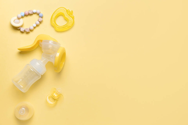 Breast pump and baby accessories on color background - Photo, Image