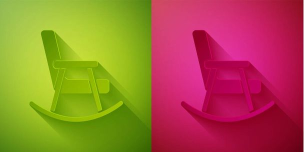 Иконка кресла-качалки вырезана на зеленом и розовом фоне. Бумажный стиль. Вектор. - Вектор,изображение