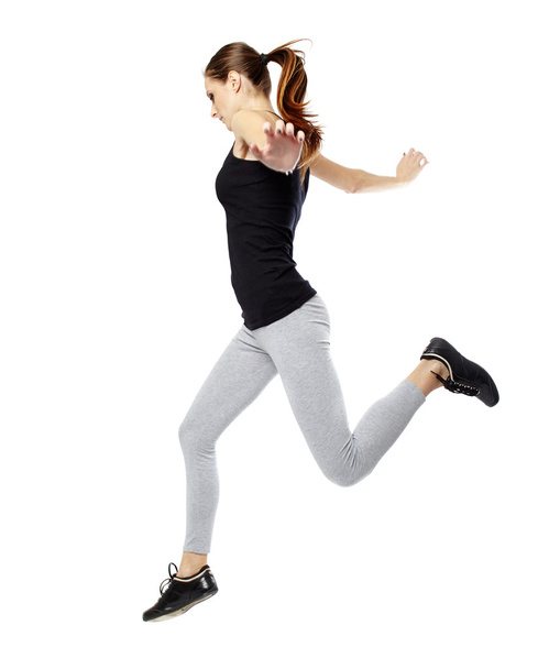 Young woman jumping - Foto, afbeelding