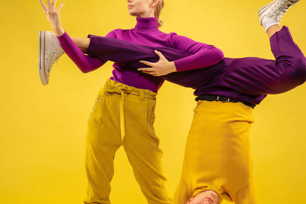 Portrait of two friends going crazy, having fun. Bright clothes, trendy colors. - Photo, Image