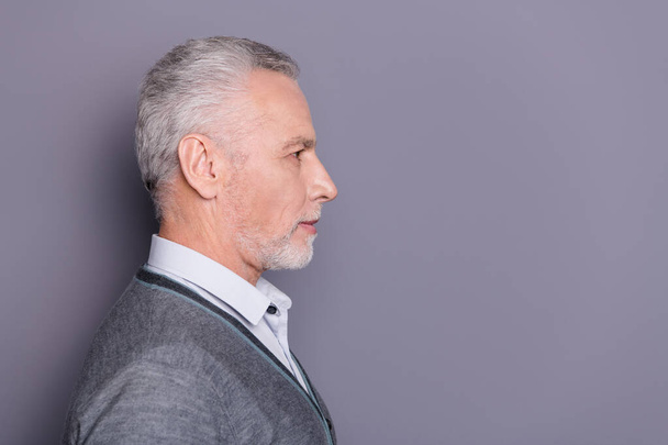 Close-up profile side view portrait of his he nice attractive serious content business shark wearing casual formal-wear copyspace isolated over gray pastel background - Foto, immagini