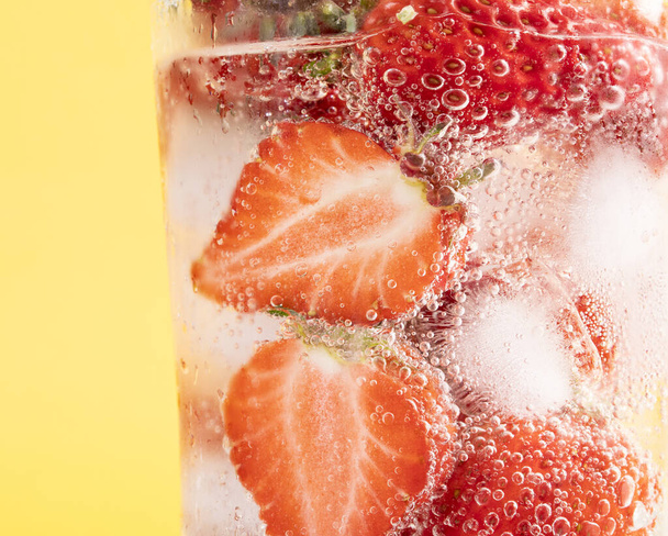 A closeup shot of iced strawberries in a glass - Photo, Image