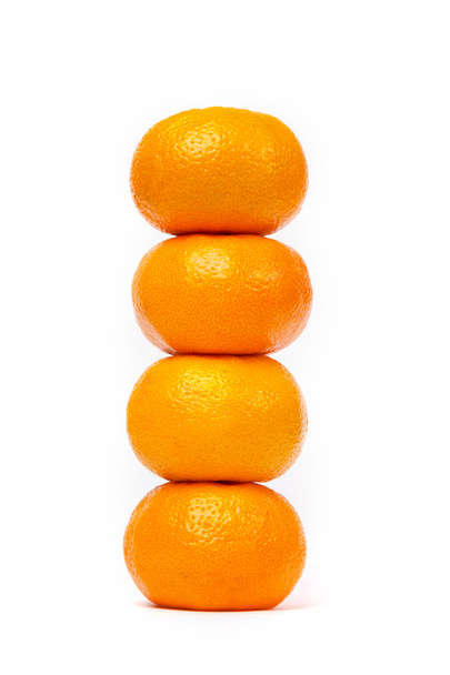 Tower of four tangerine isolated on white - Photo, Image