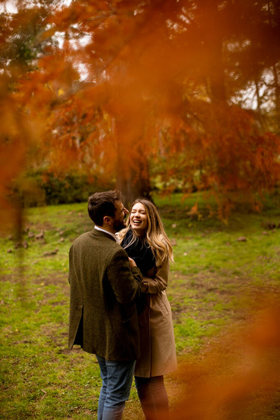 Handsome young couple in the autumn park - Photo, image