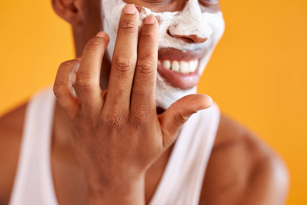 close-up photo of male hands applying mask on face - Foto, immagini