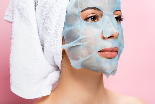 beautiful woman with mask sheet on face isolated on pink - Photo, Image
