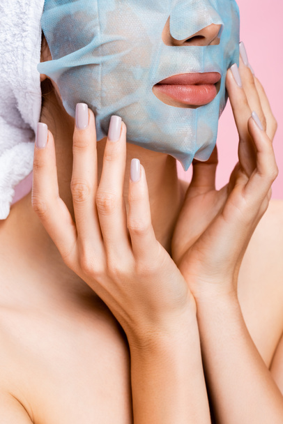 cropped view of beautiful woman with mask sheet on face isolated on pink - Φωτογραφία, εικόνα