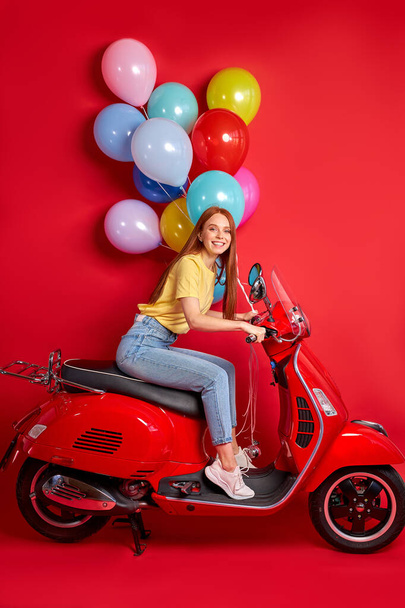 portrait of redhead smiling female on motorcycle - Zdjęcie, obraz