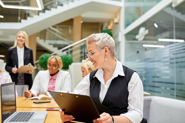 adult business woman with tablet in hands, in the office - Photo, Image